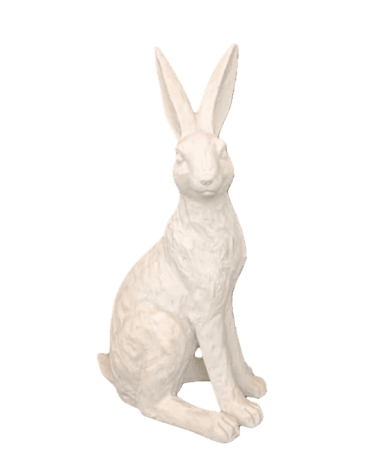 White rabbit statue on a black background