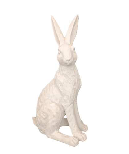 White rabbit statue on a black background