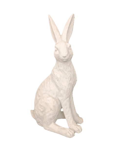 White rabbit statue on a black background