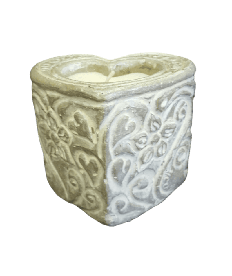 Decorative stone planter with intricate patterns on a black background