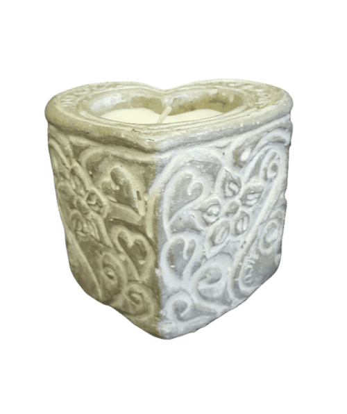 Decorative stone planter with intricate patterns on a black background
